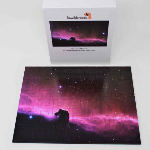 A space themed puzzle with geometric wood pieces showing the Horsehead Nebula galaxy. A great gift!
