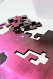 A space themed puzzle with geometric wood pieces showing the Horsehead Nebula galaxy. A great gift!