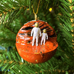 Planet Mars Christmas ornament with adult and child astronaut holding hands. Space-themed ornament