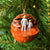 Planet Mars Christmas ornament with adult and child astronaut holding hands. Space-themed ornament