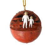 Planet Mars Christmas ornament with adult and child astronaut holding hands. Space-themed ornament