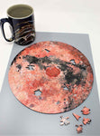 A uniqe round Mars puzzle made from wood, with oddly shaped pieces including special pieces an alien, Curiosity Rover, a spaceship and more! A round space-themed planet puzzle gift.
