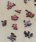 A uniqe round Mars puzzle made from wood, with oddly shaped pieces including special pieces an alien, Curiosity Rover, a spaceship and more! A round space-themed planet puzzle gift.