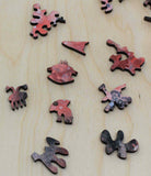 A uniqe round Mars puzzle made from wood, with oddly shaped pieces including special pieces an alien, Curiosity Rover, a spaceship and more! A round space-themed planet puzzle gift.