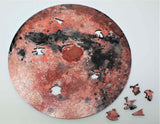 A uniqe round Mars puzzle made from wood, with oddly shaped pieces including special pieces an alien, Curiosity Rover, a spaceship and more! A round space-themed planet puzzle gift.