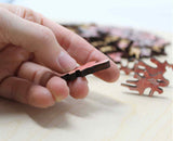 A uniqe round Mars puzzle made from wood, with oddly shaped pieces including special pieces an alien, Curiosity Rover, a spaceship and more! A round space-themed planet puzzle gift.
