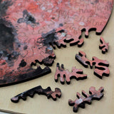 A uniqe round Mars puzzle made from wood, with oddly shaped pieces including special pieces an alien, Curiosity Rover, a spaceship and more! A round space-themed planet puzzle gift.