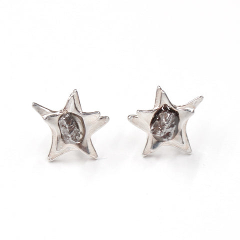 Space earrings in sterling silver with star shape and campo del cielo meteorite in center.