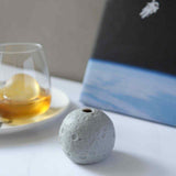 Moon ice ball maker with glass of whiskey and astronaut in background