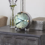 Spacey table clock by Pendulux modeled after space age automobile dashboard clock! Green face with round convex front.
