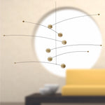 Futura mobile by danish Flensted Mobiles. Looks like moons and planets in space. Natural wood.