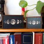 Wooden trinket boxes with lunar phases.