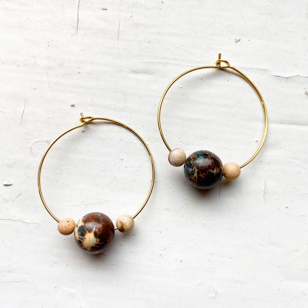 A unique pair of space earrings depicting planet Mars with it's two moons! Large brass space/planet themed hoop earrings. A fun space jewelry gift!